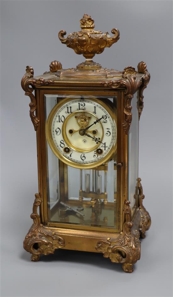 An early 20th century gilt metal four glass mantel clock 48cm high